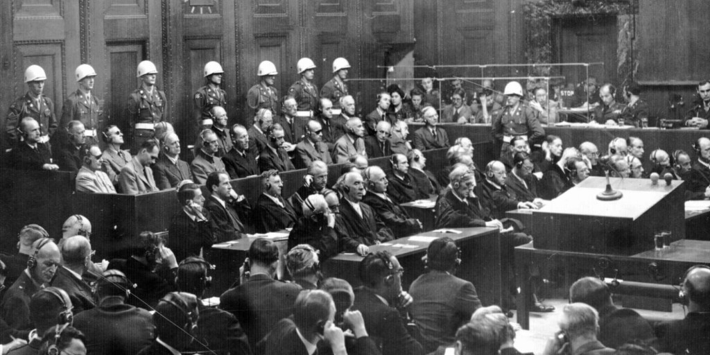 This is a general view of the War Crimes trial in Nuremberg, Germany in October of 1946, during the verdict phase of the trial. Prosecution is in the foreground and defense counsel is in front of the defendents. (AP Photo)