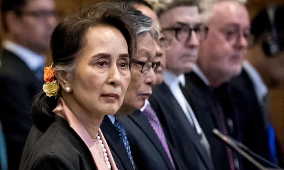 Aung San Suu Kyi impassive as genocide hearing begins