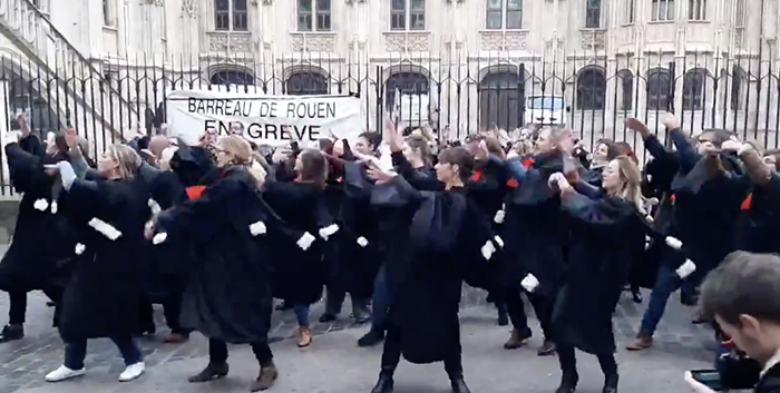 French Lawyers dance in protest to proposed law